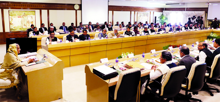 Prime Minister Sheikh Hasina addressing the members of the Cabinet at PMO on Monday after Awami League win the 11th Parliamentary election.