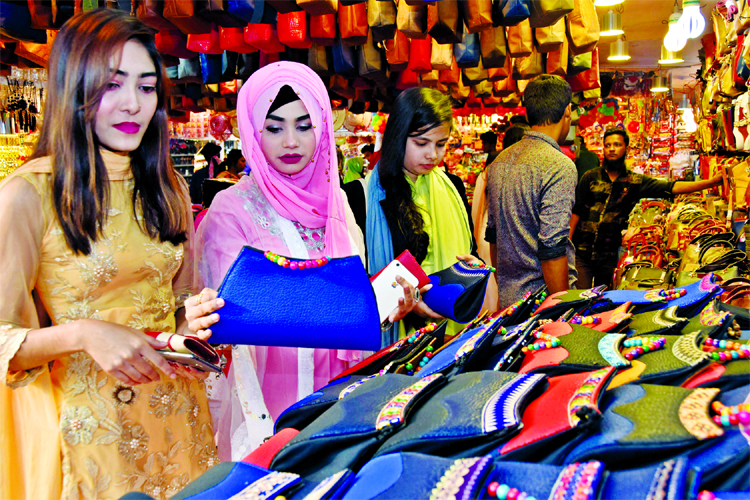 Buyers busy in choosing the best one at Dhaka Int'l Trade Fair on Monday.