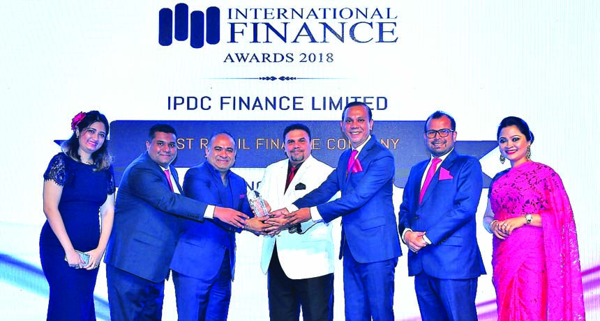 Mominul Islam, CEO of IPDC Finance Limited, receiving the International Finance Award (IFA) as the 'Best Retail Finance Company' at Jumeirah EmiratesTowers Hotel in Dubai recently. Nathan Hunter, Acting Director, Business Development and Support Departm