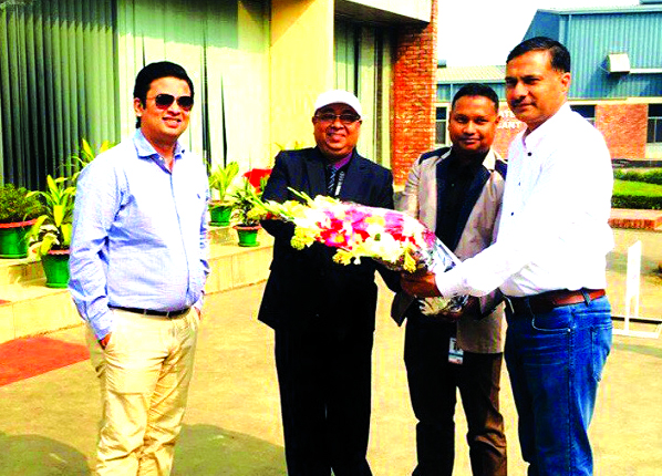 Taskeen Ahmed, Deputy' Managing Director of IFAD Group presenting a bouquet to Acting High Commissioner of India in Bangladesh Dr. Adarsh Swaika at the company's factory premises at Ashulia in Dhaka recently. The Commissioner expressed his satisfaction