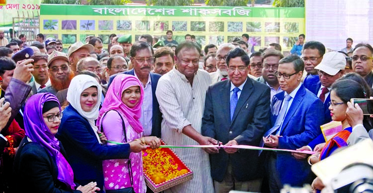 Agriculture Minister Dr. Abdur Razzak inaugurating vegetables fair by cutting ribbon in the city's Khamarbari on Thursday.