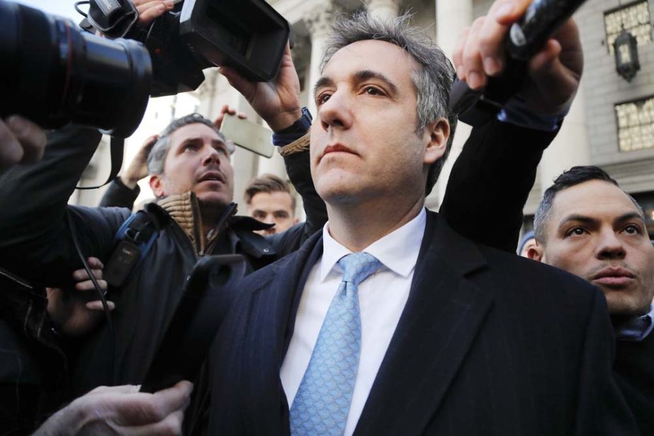 Michael Cohen walks out of federal court in New York. AP file photo