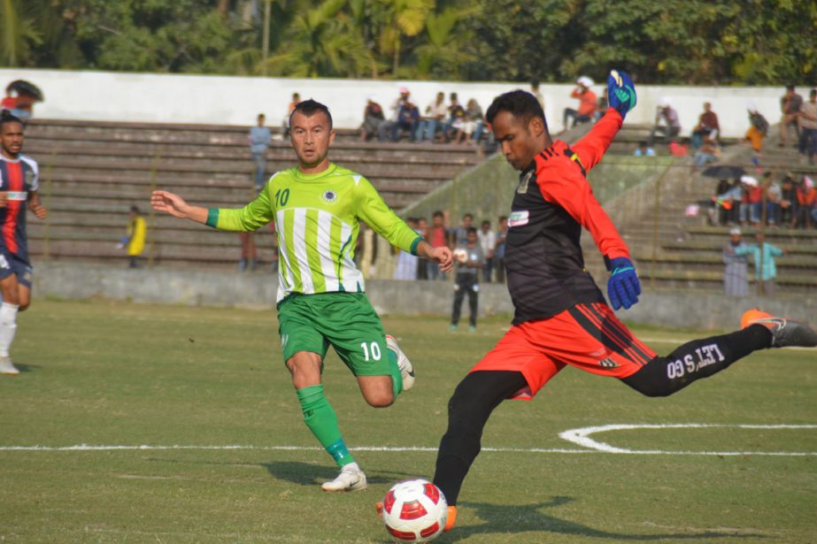 An action from the football match of the Bangladesh Premier League between Team BJMC and Saif Sporting Club at the Shaheed Bhulu Stadium in Noakhali on Thursday. Saif Sporting Club beat Team BJMC by a solitary goal.