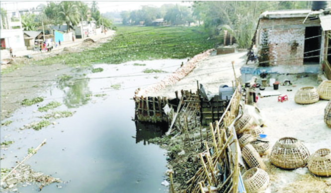 KHULNA: Influential building structures by grabbing Moyur River at the entry of Khulna amid eviction drives . This snap was taken yesterday.