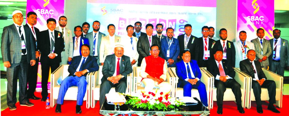 S M Amzad Hossain, Chairman of South Bangla Agriculture and Commerce (SBAC) Bank Limited, poses for a photograph with the participants of its 'Business Conference 2019' at Lockhpur Group's conference hall in Fakirhat in Bagerhat on Friday. Md. Golam Fa