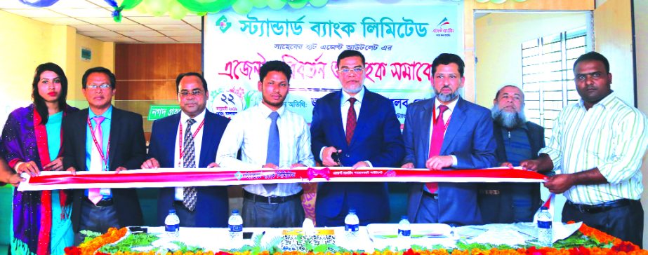 Md. Motaleb Hossain, DMD of Standard Bank Limited, inaugurating a replaced Agent Banking Outlet at Shaheberhat Bazar in Begumgonj in Noakhali recently as chief guest. Md. Rezaur Rahman, Head of Agent Banking Division and other officials of the Bank and lo