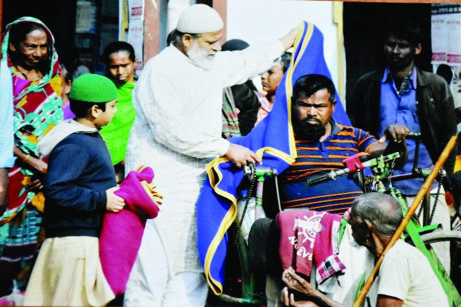 NARAYANGANJ: Md Shahidul Islam Ripon, President, Shaheed Zia Smriti Sangsad, Narayanganj District Unit distributing winter clothes among the poor people on the occasion of the 83rd birthday of former president Ziaur Rahman on Thursday. .