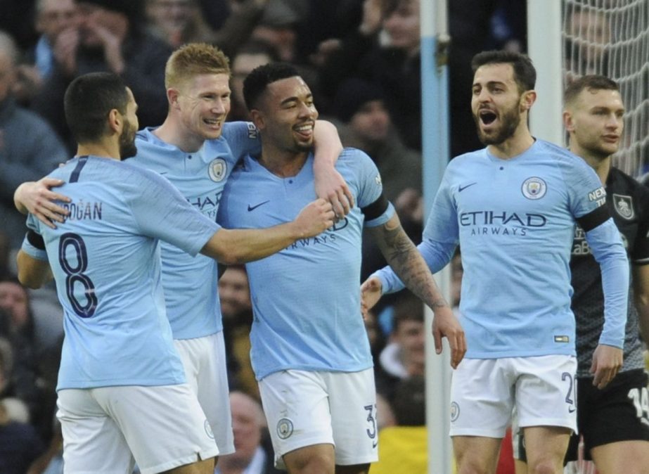 (Left to right) Manchester City's Ilkay Gundogan, Kevin De Bruyne, Gabriel Jesus and Bernardo Silva celebrate after scoring their side's opening goal during the FA Cup 4th round match between Manchester City and Burnley at Etihad stadium in Manchester o