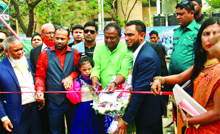 Commerce Minister Tipu Munshi, inaugurating free entertainments for autistic children at Sarika Fantasy Park at Dhaka International Trade Fair in the city on Sunday. Mahbubur Rahman Palash, CEO of the park, Bijoy Bhattacharjee, Vice Chairman, Abdur Rouf,