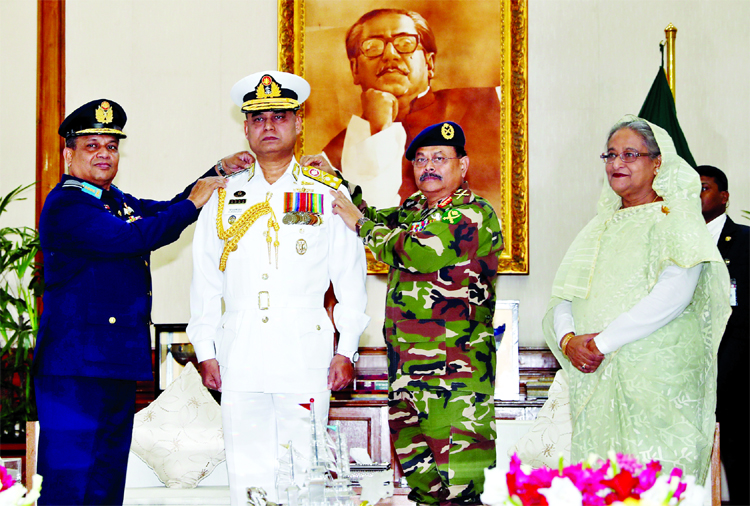 Newly appointed Chief of Bangladesh Naval Staff Abu Mozaffar Mohiuddin Mohammad Aurangzeb Chowdhury was adorned with the rank of Vice Admiral by Army Chief General Aziz Ahmed and Chief of Air Force Air Chief Marshal Masihuzzaman Serniabat in presence of P