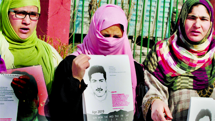 Safiya Azad (centre) said she kept her husband's half-smoked cigarette from the day he went missing.