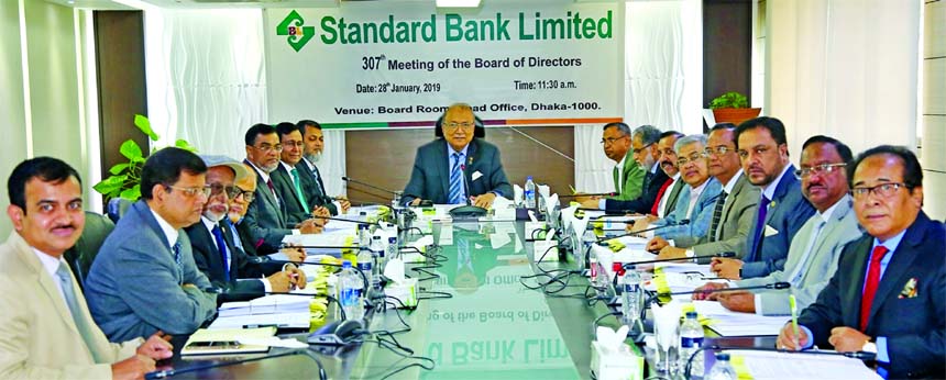 S. S. Nizamuddin Ahmed, Chairman of Audit Committee of Board of Directors of Standard Bank Limited, presiding over its 88th audit meeting at the Bank's head office on Monday. Mamun-Ur-Rashid, CEO, Additional Managing Director Md. Tariqul Azam and Deputy