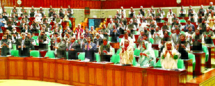 Prime Minister and Leader of the Parliament Sheikh Hasina along with other members of the Parliament offering munajat on the obituary reference at the first session of the Eleventh Parliament on Wednesday.