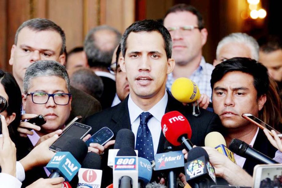 Venezuelan opposition leader and self-proclaimed interim president Juan Guaido speaks to the media before a session of the Venezuela's National Assembly in Caracas, Venezuela on Tuesday.