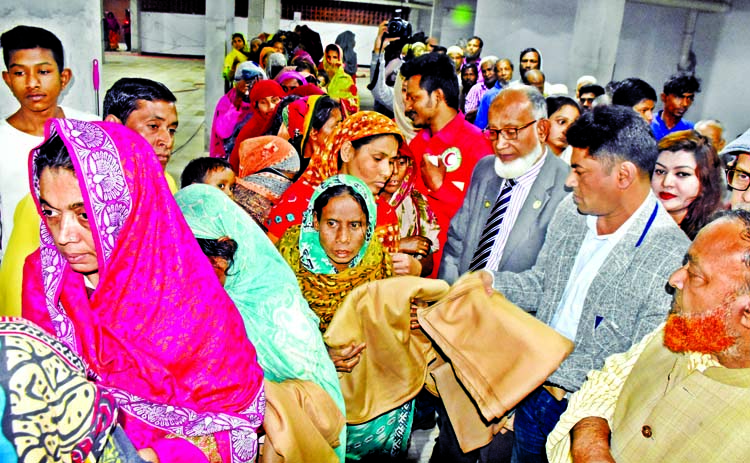 26 No. Ward Councilor of DSCC Hashibur Rahman Manik distributing blankets among the cold-hit poor people at a ceremony organised by Bangladesh Red Crescent Society, City Unit in front of Mayor Hanif Mosque adjacent to Azimpur Graveyard in the city on Thur