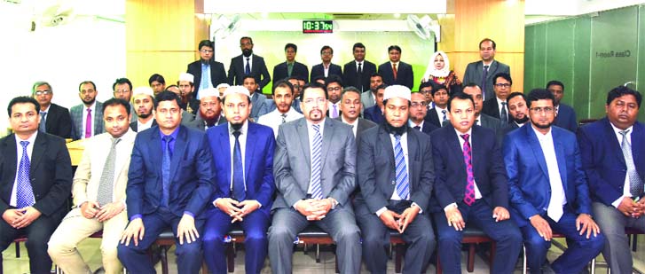 Farman R Chowdhury, Managing Director of Al-Arafah Islami Bank Limited, poses for a photograph with the participants of a day-long training workshop on 'Core Risk Management in AIBL' at its Training and Research Institute in the city on Wednesday. Md. A
