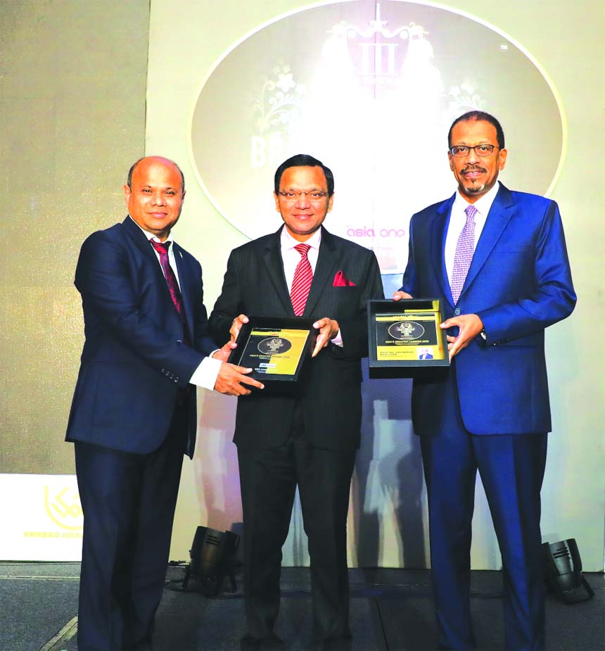 Engr. Md. Abu Noman Howlader, Managing Director of BBS Cables Limited, receiving the 'Asia's Greatest Leaders Award 2018' and 'Asia's Greatest Brands Award 2018' respectively under cables category at a function held at Marina Bay Sands Expo and Conv
