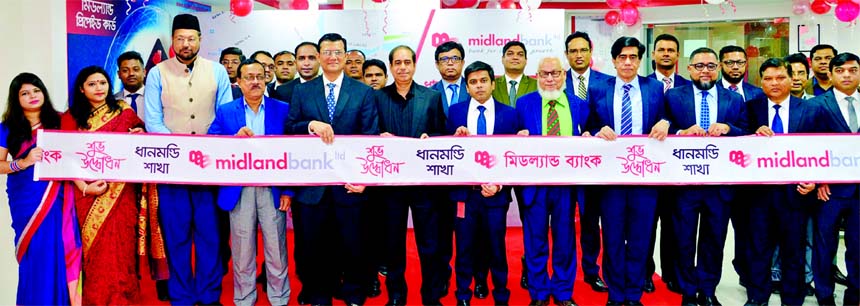 Rezaul Karim, Director and EC Chairman, Board of Directors of Midland Bank Limited, inaugurating its relocated Dhanmondi Branch at Rowshan Ara Tower, 55 Satmosjid Road in Dhanmondi in the city recently. Md. Ahsan-uz Zaman, Managing Director, Mohammed Maso