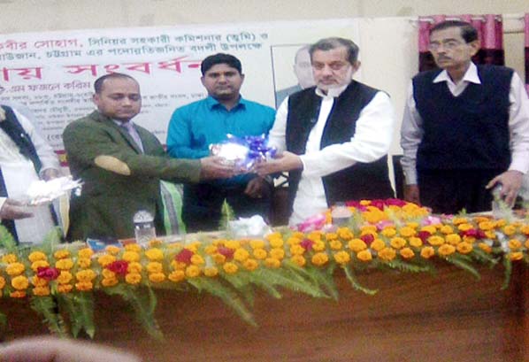 ABM Fazle Karim Chowdhury MP handing over crest wtih gift to Jonaid Kabir Sohag, Senior Asstt. Commissioner (Land) Raozan ( first from left) at Upazila Auditorium on Monday last.