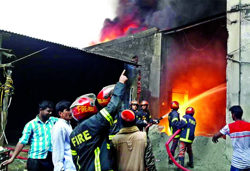 A devastating fire broke out at Mobil godown of RML Asian Spinning Factory at Nandalalpur of Fatulla in N'ganj on Saturday. Later fire fighters douse the flame.