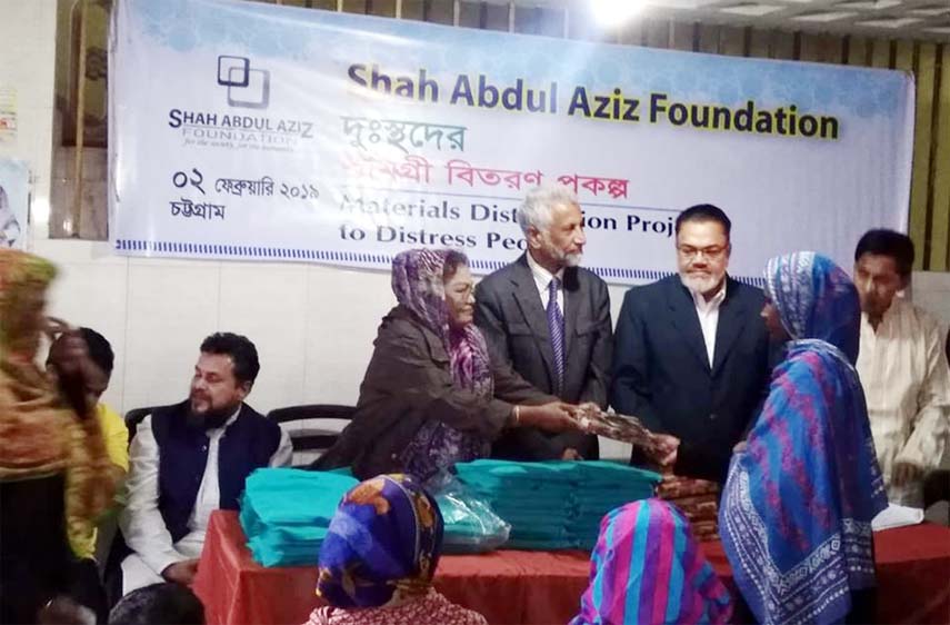 Shah Abdul Aziz Foundation distributing and saris lungiies among the distressed people of West Bakolia Ward on Saturday. Chairman of Shah Abdul Aziz Foundation SM Sawkat Hossain Komru ,General Secretary Ali Monsur ,Treasurer Ziauddin Khaled Chowdhury were