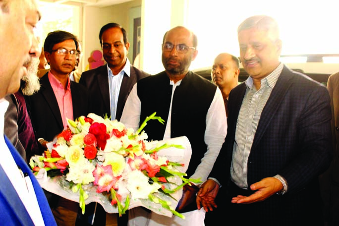 Housing and Public Works Minister SM Rezaul Karim being greeted by Chief Engineer of LGED Md Abul Kalam Azad during his visit at LGED Headquarters yesterday.