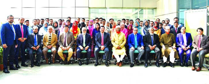 Farman R Chowdhury, Managing Director of Al-Arafah Islami Bank Limited, poses for a photograph with the participants of a two-week long 'Foundation Course on Banking' for newly recruited officers at the Banks Training and Research Institute in the city