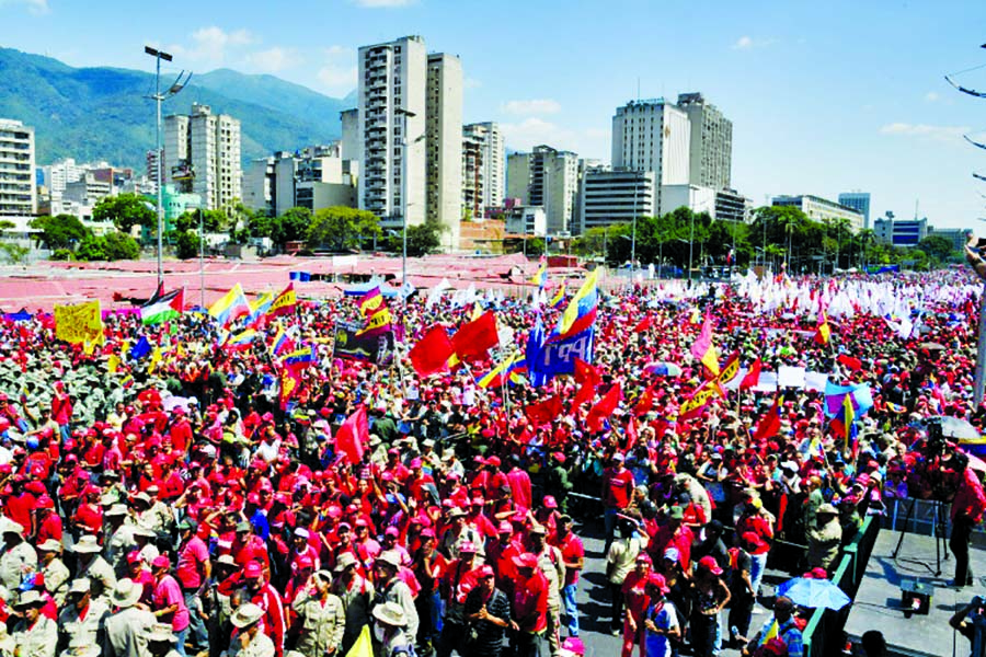 Tens of thousands of people turned out Monday for competing shows of support for Guaido and for Maduro.