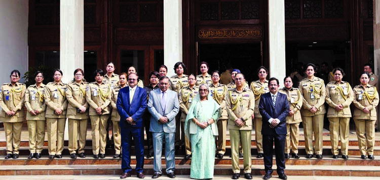 Prime Minister Sheikh Hasina poses for a photo session with high police officials at the Prime Minister's office on Tuesday on the second day of Police Week. BSS photo