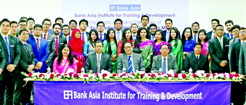 A Rouf Chowdhury, Chairman of Bank Asia Limited, poses for a photograph with the participants of 49th Foundation Training Course for 42 Management Trainees (MTs) in the concluding ceremony held at the Bank's Training & Development Institute in the city o