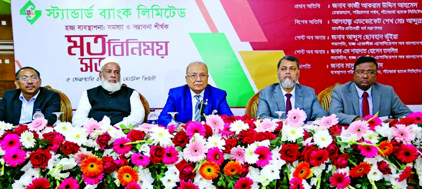 Kazi Akram Uddin Ahmed, Chairman of Standard Bank Limited, presiding over a view exchange meeting on "Haj Management: Problems & Prospective" organized by the Bank at a hotel in the city on Tuesday while State Minister for Ministry of Religion Adv. Shei