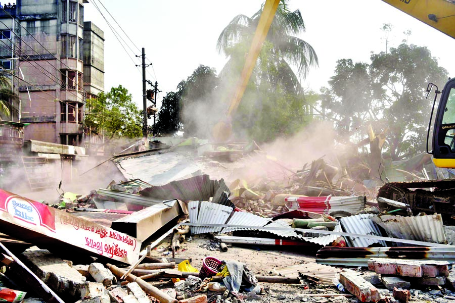 BIWTA demolishes about 494 illegal structures including multi-storey building built on the banks of Buriganga River. This photo was taken from Kamrangirchar area on Tuesday.