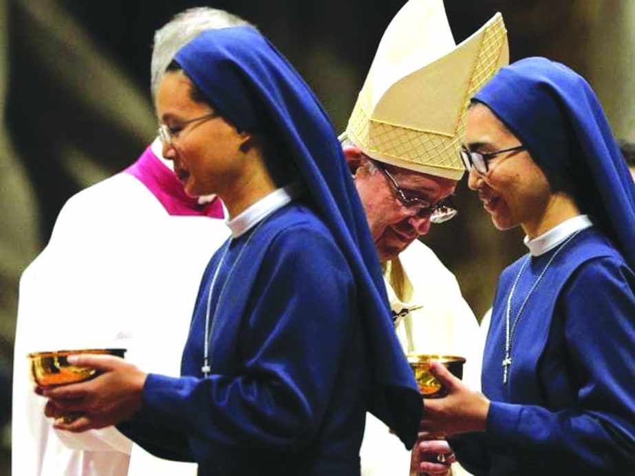 Nuns walk past Pope Francis during a Mass in St. Peter's Basilica at the Vatican. The Pope admitted that nuns have been sexually abused by clerics.