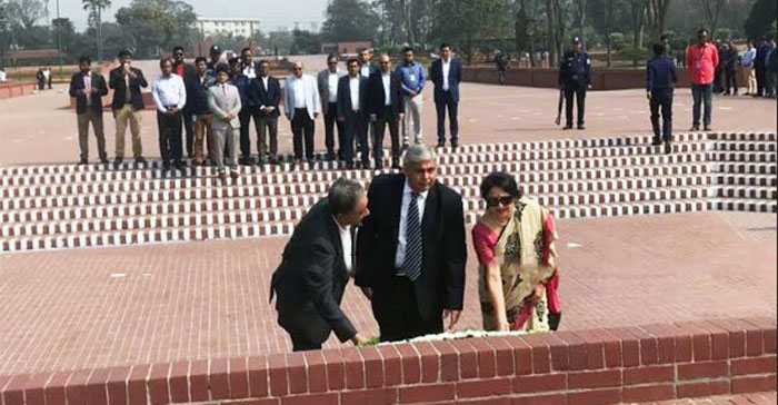 Chairman of the International Cricket Council (ICC) Shashank Manohar (center) pays tribute to the Liberation War Martyrs by putting floral wreaths at the National Mausoleum in Savar on Thursday.