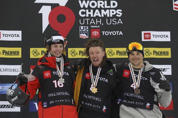 First-place finisher James Woods (center) of Britain, second-place Birk Ruud, (left) of Norway, and third-place Nicholas Goepper (right) of the United States, celebrate on the podium following the men's slopestyle skiing world championship in Park City,