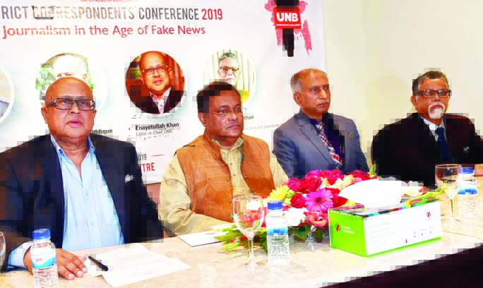 Information Minister Dr. Hasan Mahmud, along with other distinguished persons at the annual conference of UNB District Correspondents at the Cosmos Center in the city on Saturday.
