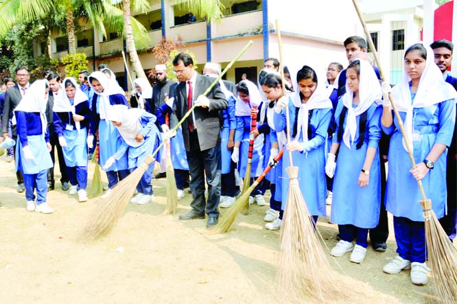 BOGURA: Shahadat Hossain, Principal of Police Line School and College in Bogura conducting cleanliness drive at the school compound on Thursday.