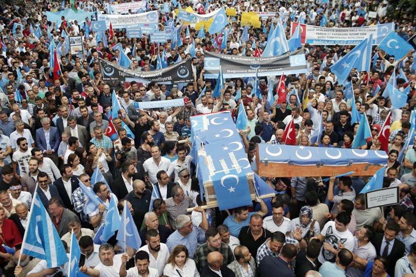 Uighurs living in Turkey and their supporters, some carrying coffins representing Uighurs who died in China's far-western Xinjiang Uighur region, chant slogans as they stage a protest in Istanbul, against what they call as oppression by Chinese governmen