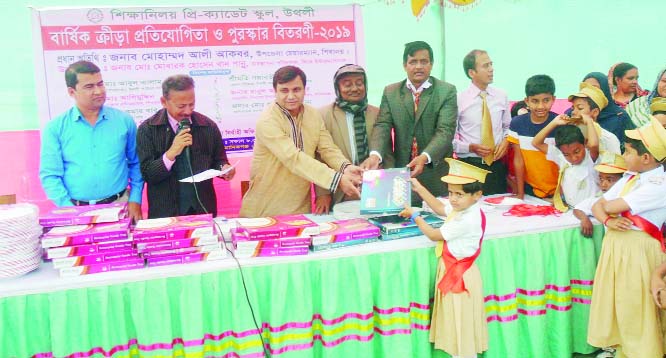 MANIKGNAJ: Mohammad Ali Akbar, Chairman, Shibalaya Upazila distributing prizes among the winners of annual sports competition of Shikshaniloy Pre- Cadet School as Chief Guest on Friday.