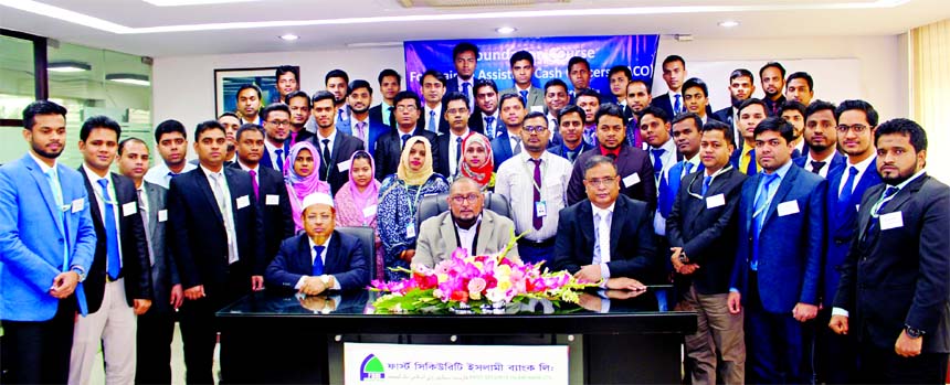 Md. Mustafa Khair, DMD of First Security Islami Bank Limited, poses for a photograph with the participants of its 29th FTC for the Trainee Assistant Cash Officers at the Bank's Training Institute in the city on Saturday. Other senior officials of the Ban