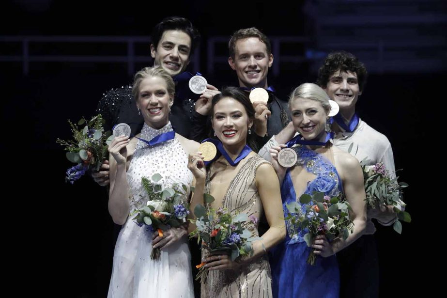 Ice dance competition winners (from left) silver medalists, Kaitlyn Weaver and Andrew Poje, of Canada, gold medalists, Madison Chock and Evan Bates, of the United States, and bronze medalists, Piper Gilles and Paul Poirier, of Canada, pose at the Four Con