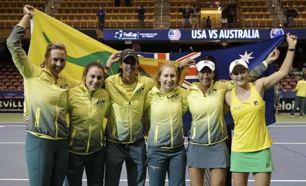 Australia's captain Alicia Molik (left) poses with her team (from left) Kimberly Birrell, Astra Sharma, Daria Gavrilova, Priscilla Hon and Ashleigh Barty after winning their first-round Fed Cup tennis match against the United States in Asheville, N.C. on