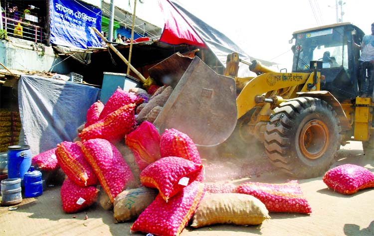 Dhaka North City Corporation authority evicting the illegal structures and shops from city's Shah Ali Mazar Road in Mirpur on Monday.