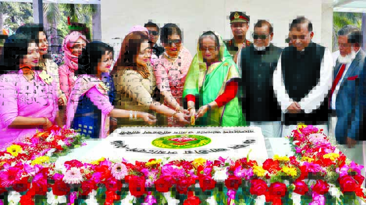 Prime Minister Sheikh Hasina cutting cake at the 39th National Rally of Bangladesh Ansar and Village Defence Party (VDP) at Ansar-VDP Academy in Shafipur on Tuesday. BSS photo