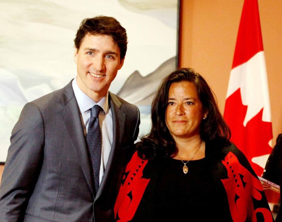 Newly appointed Canadian Veterans Affairs Minister Jody Wilson-Raybould poses for a photo with Prime Minister Justin Trudeau as he shuffles his cabinet after the surprise resignation of Treasury Board President Scott Brison, in Ottawa.