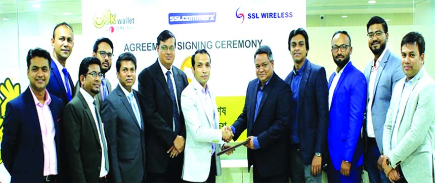 Gazi Yar Mohammed, Head of Digital & Inclusive Financial Services of ONE Bank Limited and Ashish Chakraborty, Chief Operating Officer of Software Shop Limited (SSL Wireless), exchanging an agreement signing document at the Bank's head office in the city