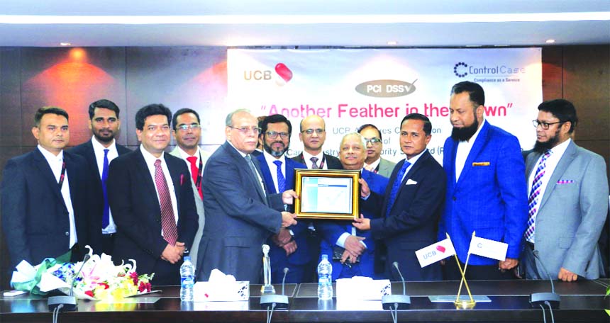 Suresh Dadlani, President of Control Case LLC, handing over the PCI-DSS Certificate of compliance to Mohammed Shawkat Jamil, Managing Director of United Commercial Bank (UCB) Limited at the Banks corporate office in the city recently. UCB completed the co