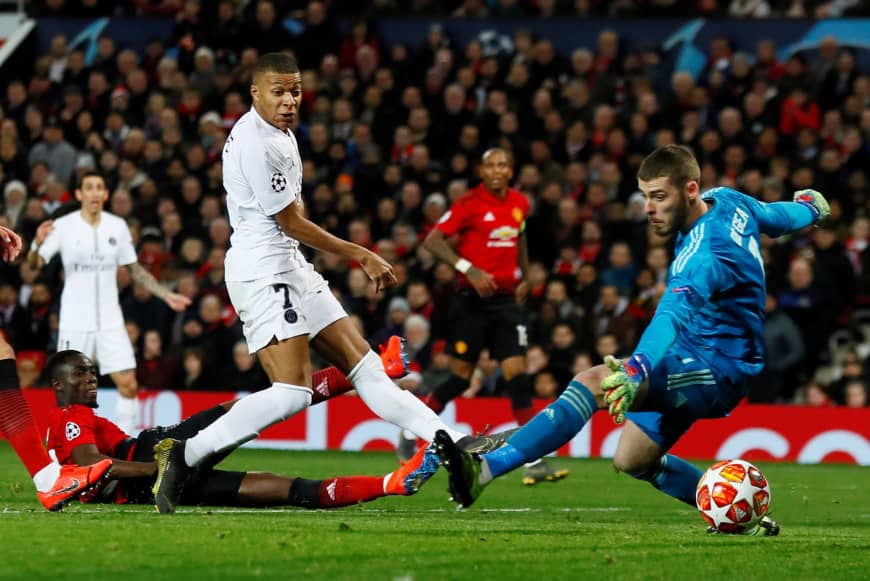 PSG's Kylian Mbappe scores the team's second goal against Manchester United in the first leg of the Champions League round of 16 at Old Trafford on Tuesday.