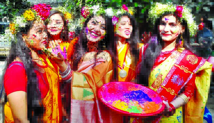 Young female artistes and students of DU's Faculty of Fine Arts celebrating Pahela Falgun on its premises on Wednesday.