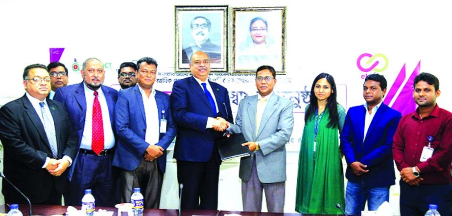 Syed Waseque Md. Ali, Managing Director of First Security Islami Bank Limited (FSIBL) and Md. Mustafizur Rahman, Project Director of a2i (Access to Information), exchanging an agreement signing document for collecting utility bills through FSIBL Mobile Ba